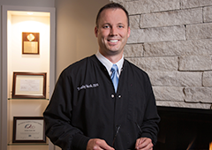 Doctor Vacek smiling in hallway of Amberly Dental